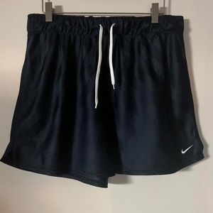 Navy Nike shorts with white embroidered logo